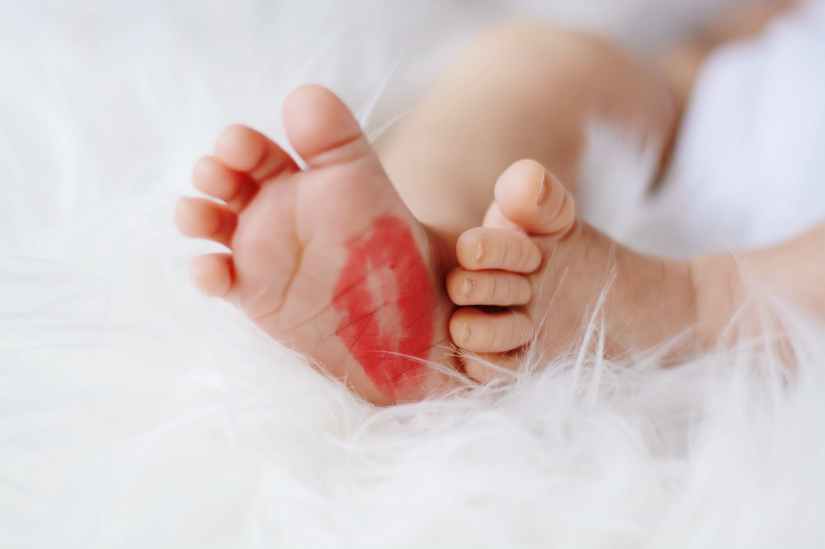 baby foot with red kiss mark